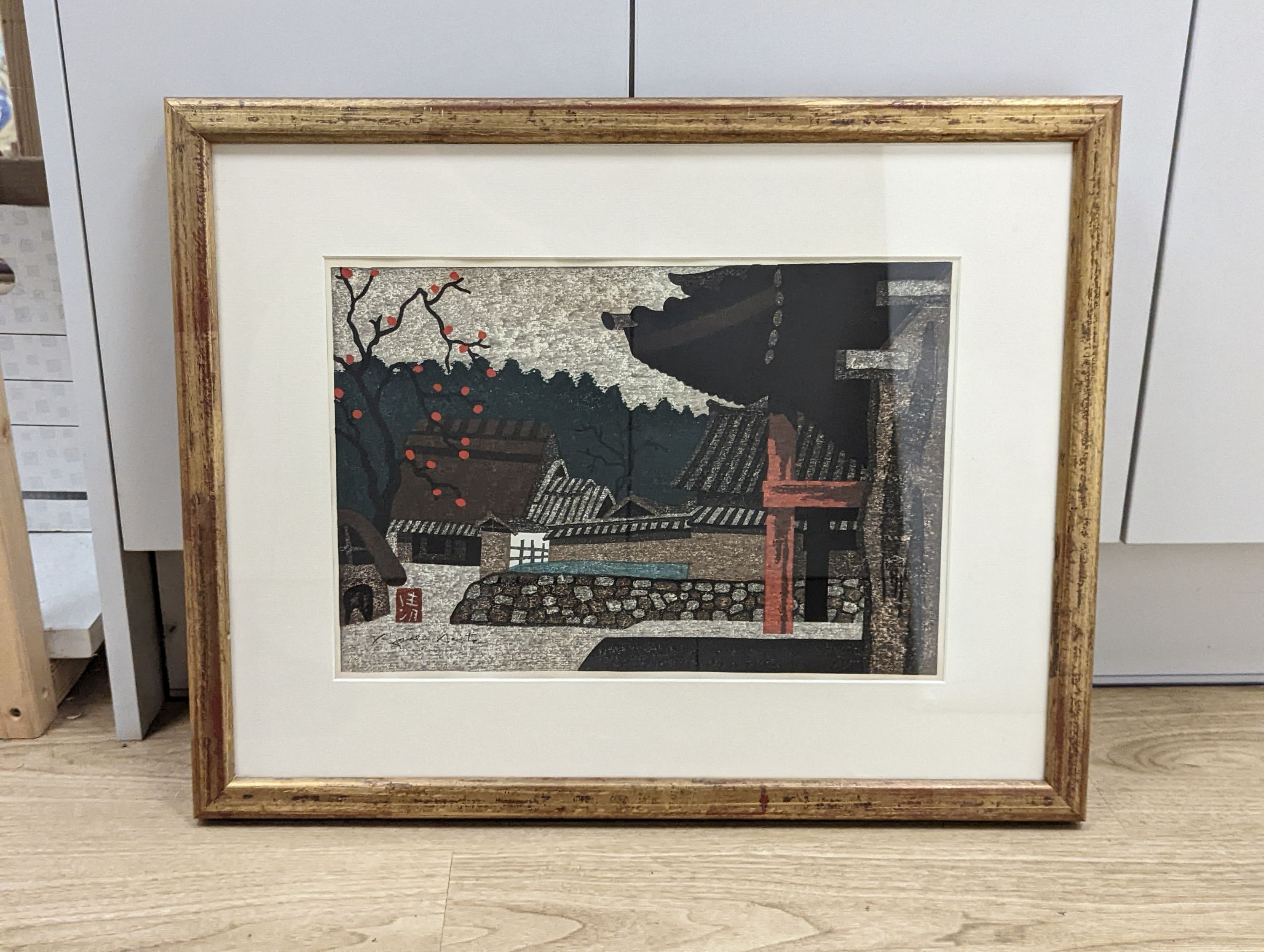 Kiyoshi Saito (1907-1997), woodblock print, View of a village and fruiting tree, 26 x 39cm